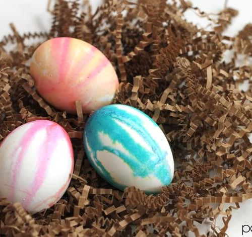 make your own watercolor drip dyed easter eggs with regular egg colors. Fun and pretty!