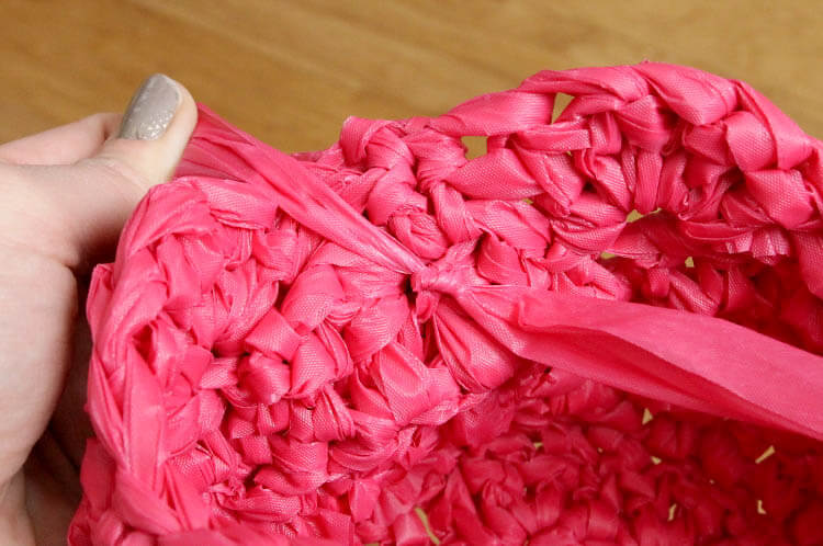 crochet an easter basket out of plastic yarn! Make your own colorful plastic yarn from old party tablecloths
