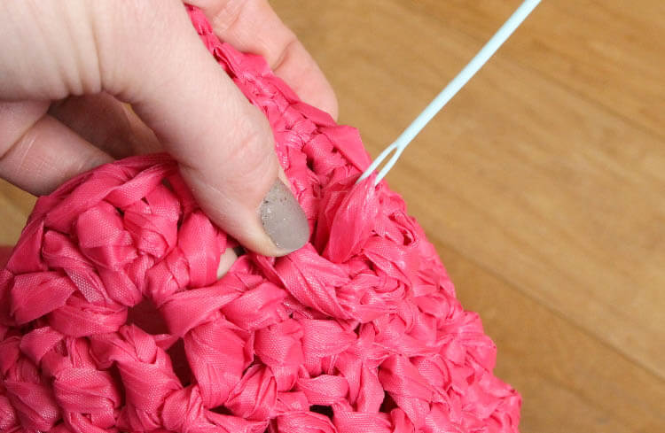 crochet an easter basket out of plastic yarn! Make your own colorful plastic yarn from old party tablecloths