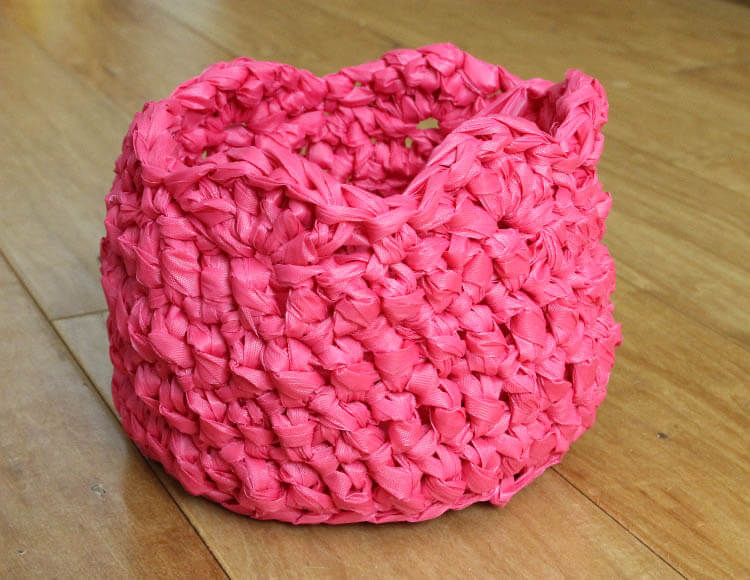 crochet an easter basket out of plastic yarn! Make your own colorful plastic yarn from old party tablecloths