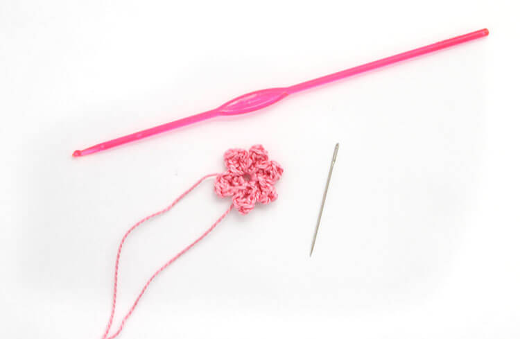 Make your own pretty Crochet Flower Hair Combs with tiny crocheted flowers. Free crochet pattern and photo tutorial.