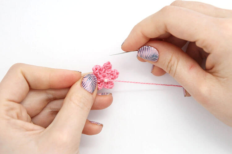 Make your own pretty Crochet Flower Hair Combs with tiny crocheted flowers. Free crochet pattern and photo tutorial.