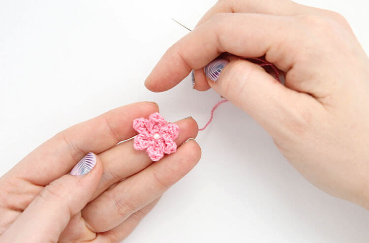 Make your own pretty Crochet Flower Hair Combs with tiny crocheted flowers. Free crochet pattern and photo tutorial.