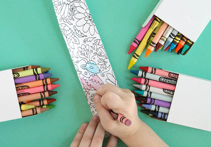 Make your own DIY coloring page bracelets. Turn your coloring book or your kids' artwork into a piece of jewelry! Perfect DIY Mother's Day Bracelets!