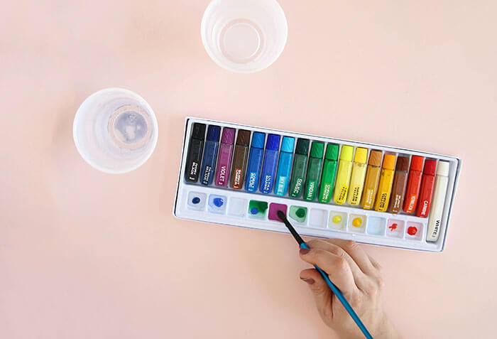 easy watercolor art - make pretty designs using a simple rubber cement resist technique - learn how to do it yourself with this full photo tutorial