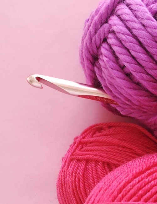 pink yarn and crochet hook