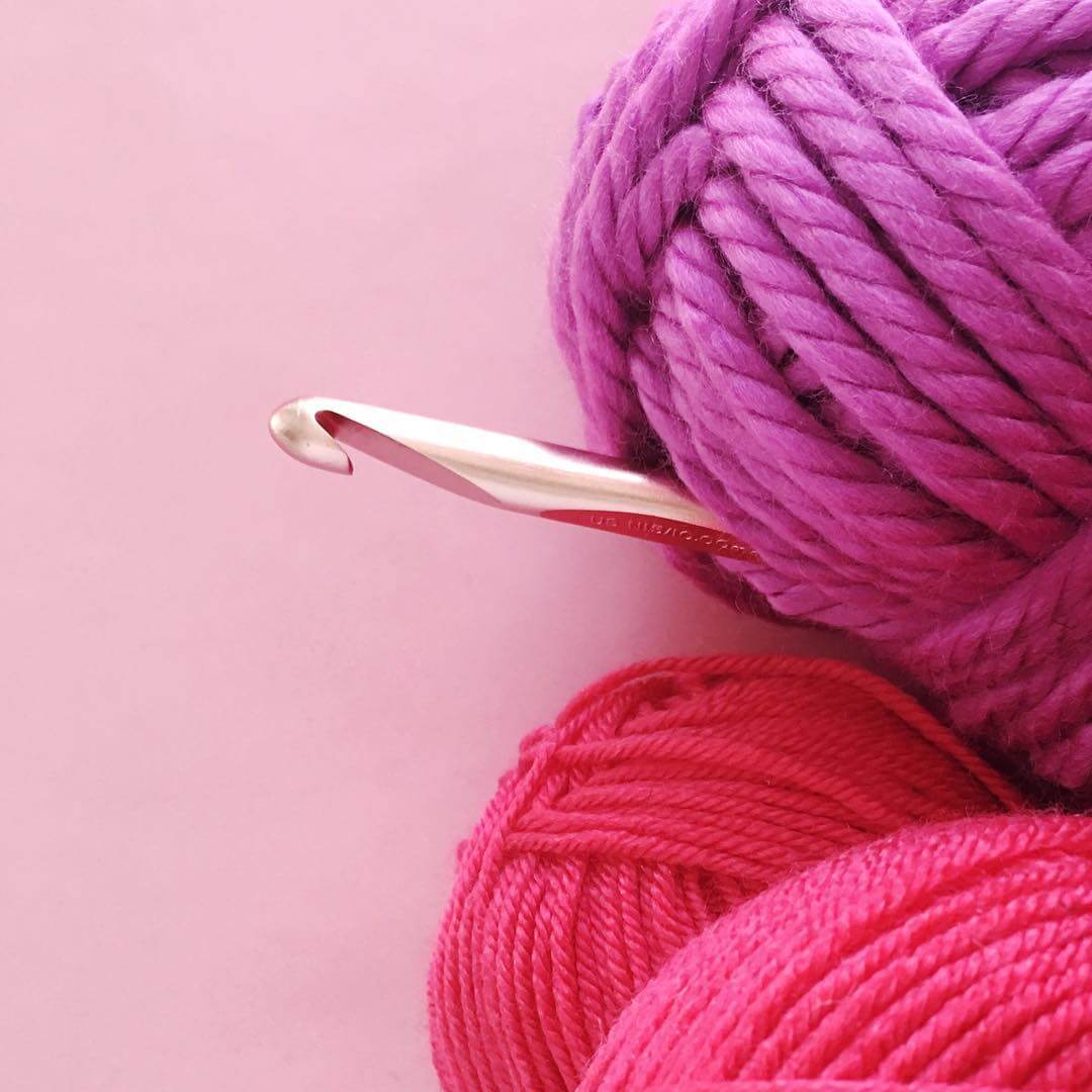pink yarn and crochet hook