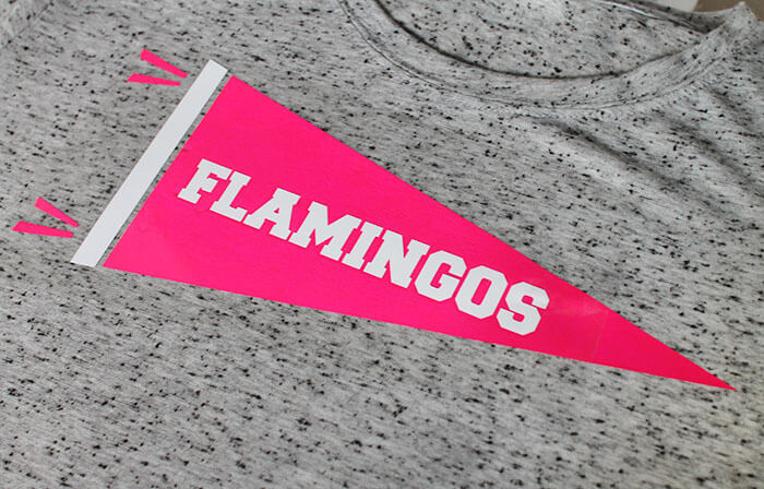 Make your own Neon Pennant Shirt for yarn, flamingos, or whatever you are enthusiastic about. Free Silhouette cut file and tutorial