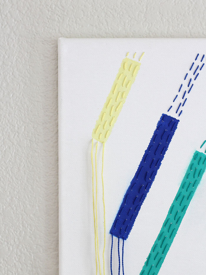 Make your own unique DIY Modern Wall Art inspired by a modern quilt design. This piece is easy to make with a few simple supplies and this step-by-step tutorial.