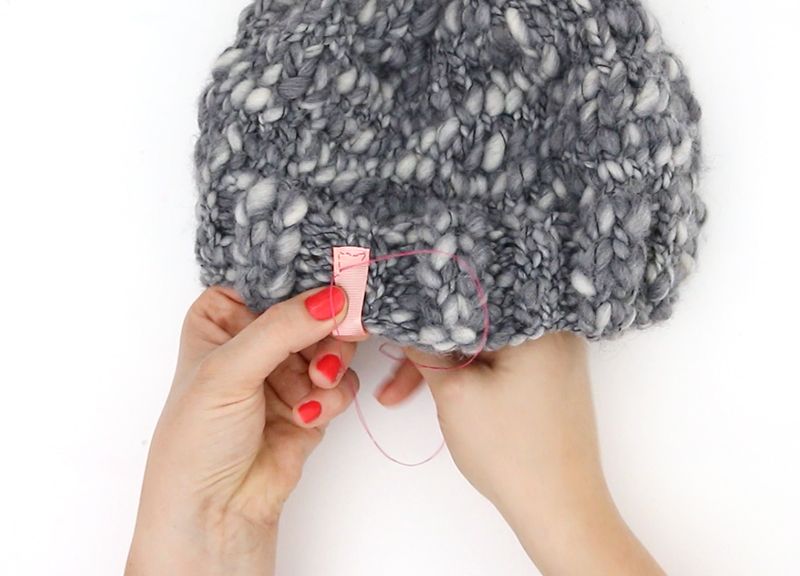 thick and thin knit hat - sewing on tag