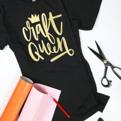craft queen t-shirt with iron on vinyl design surrounded by iron and heat transfer vinyl