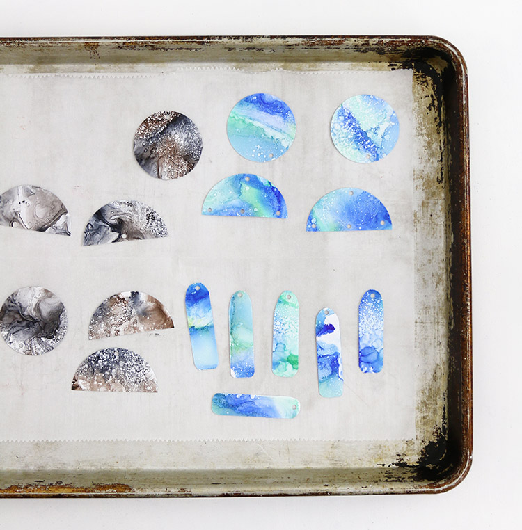 parchment lined baking sheet for baking shrinky dink earrings