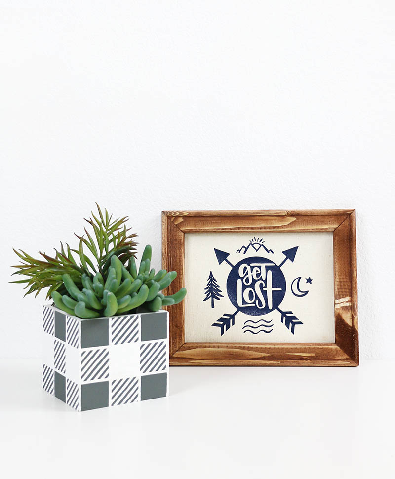 DIY buffalo plaid planter made using DIY stencils and get lost camping sign