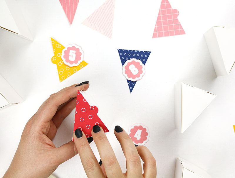 attach box fronts and numbers to boxes for silhouette advent calendar