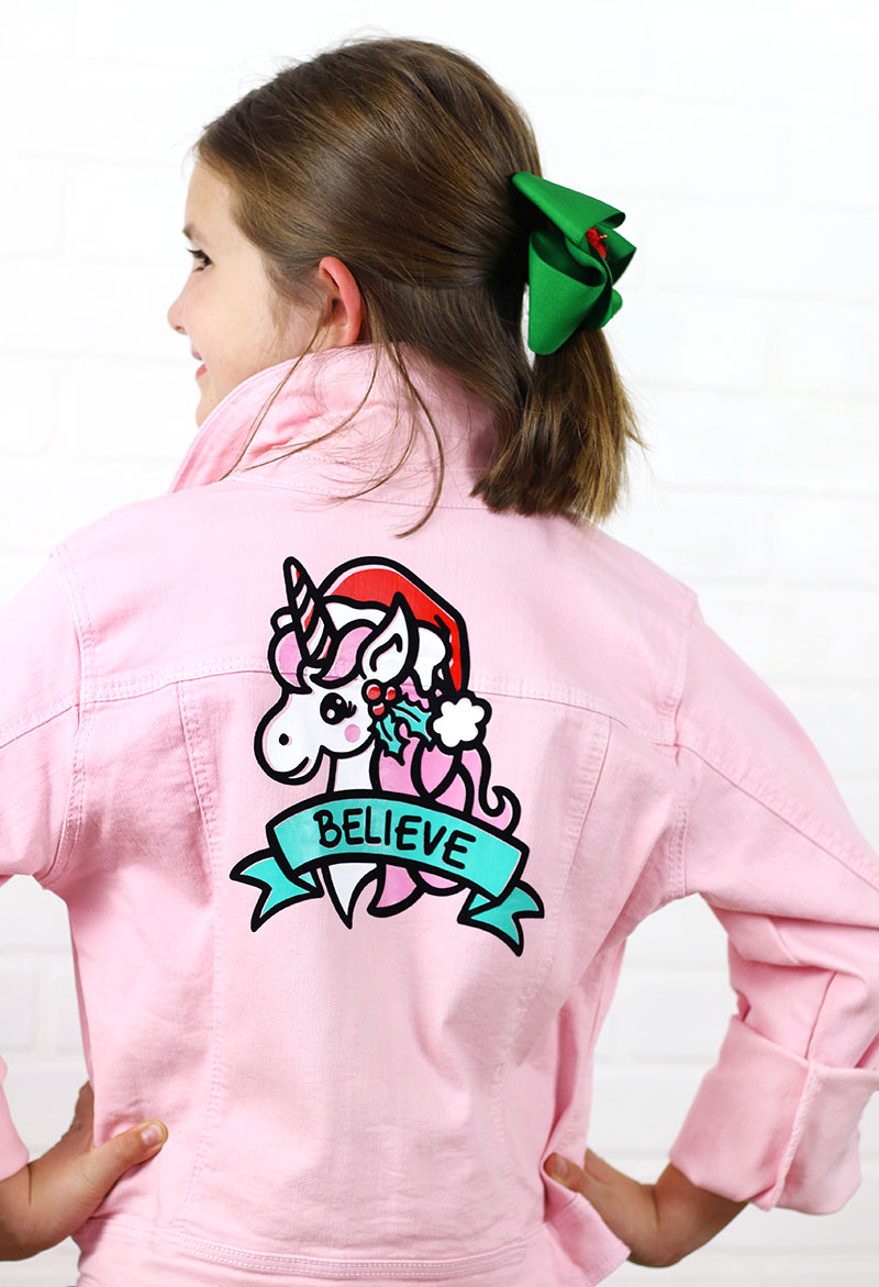 believe christmas unicorn cut file for silhouette cricut on pink jacket