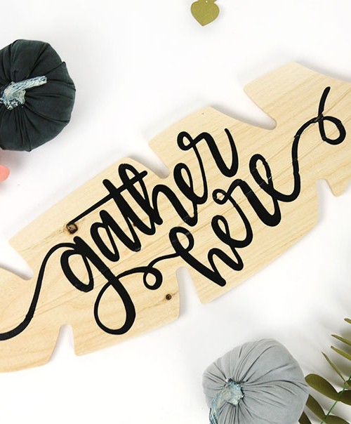 gather here wooden feather sign