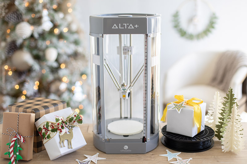 silhouette alta plus 3D printer on table with gifts and 3D printed ornaments