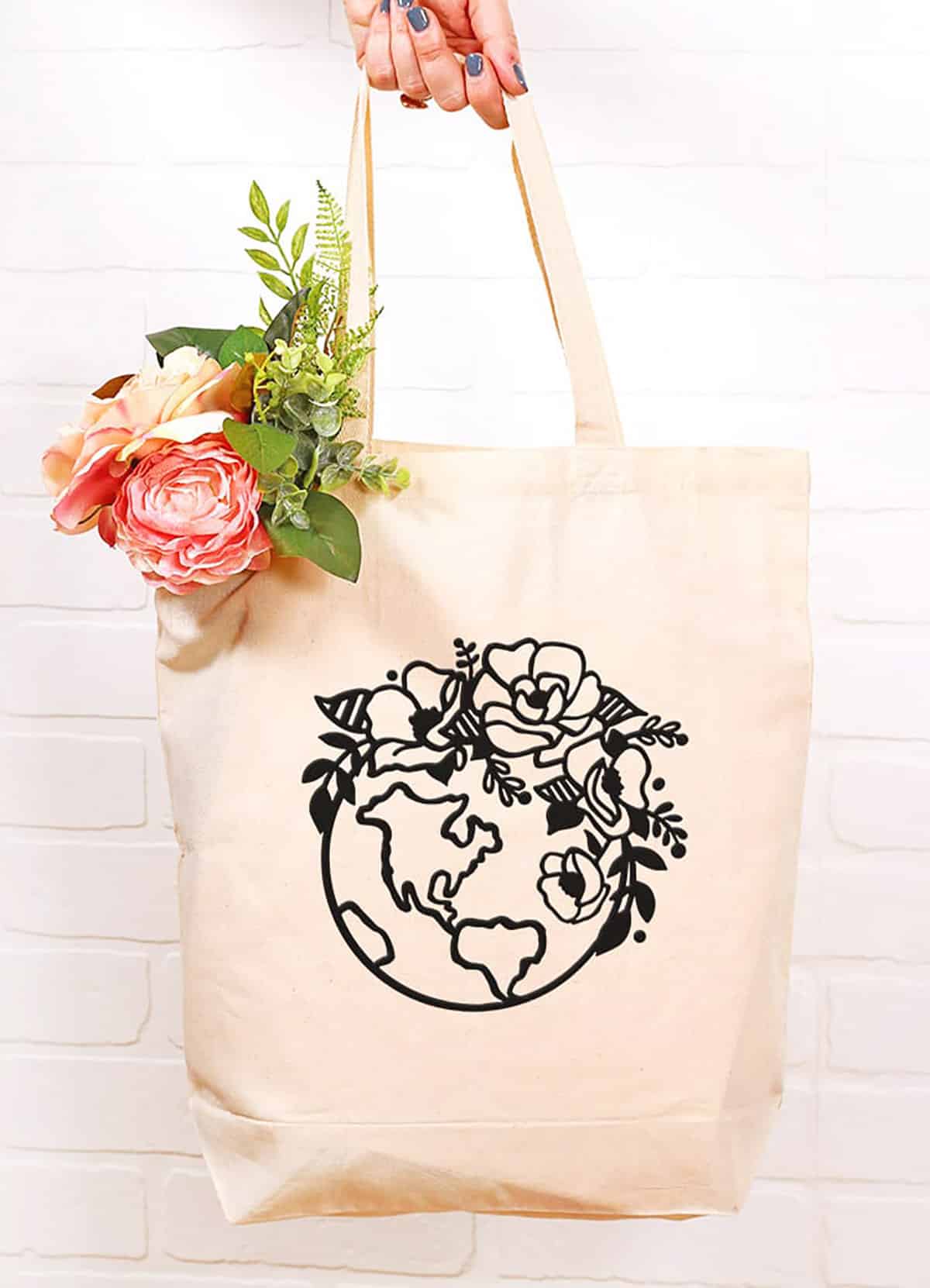 reusable tote bag with earth day floral globe svg design