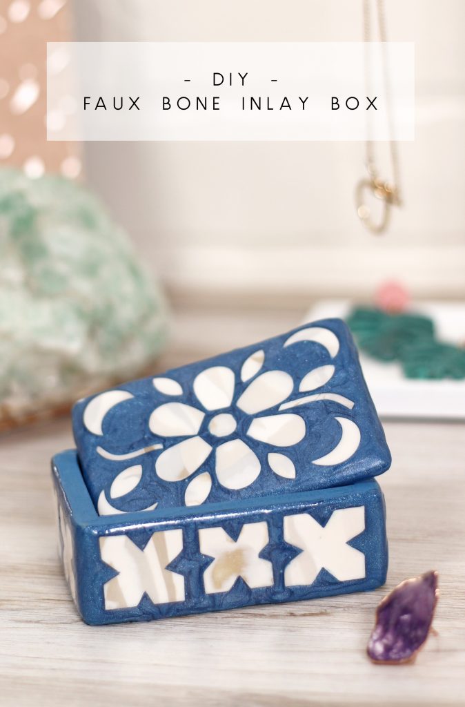 small blue trinket box with a white mosaic design