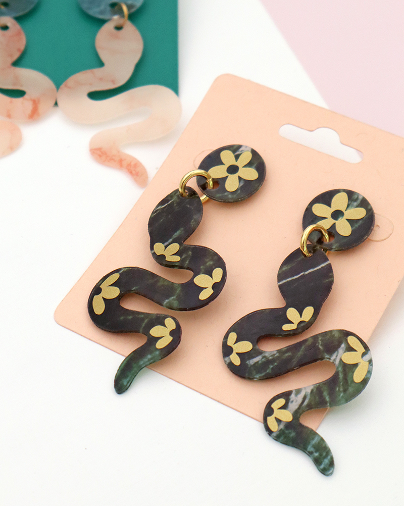 diy green marble look snake earrings with gold flower vinyl decals