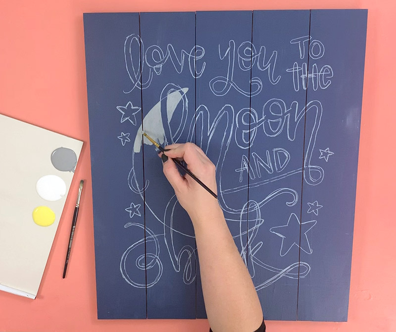 Painting to the moon and back design on wooden pallet sign