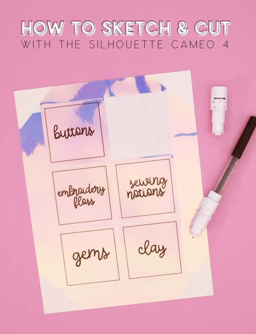 A sheet of iridescent craft room supply labels on a pink background. A Silhouette Cameo 4 blade and a black marker in a Silhouette pen holder tool lay on the table next to the craft room labels.