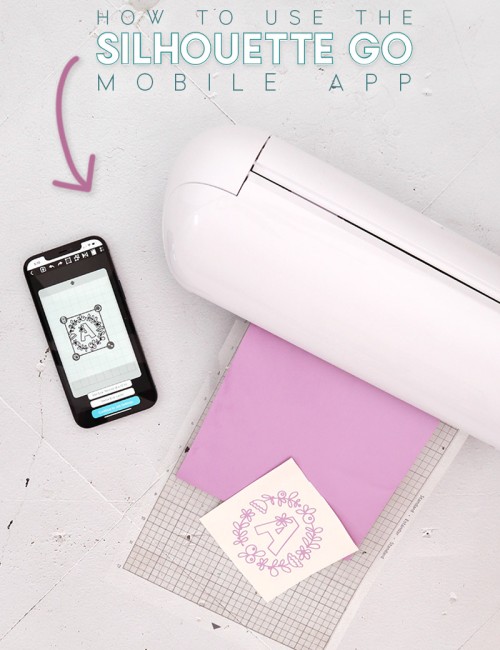 A Silhouette Portrait 3 machine sits on a table with light purple vinyl loaded into the machine. Next to the machine on the table sits an iphone displaying the Silhouette Go mobile app.