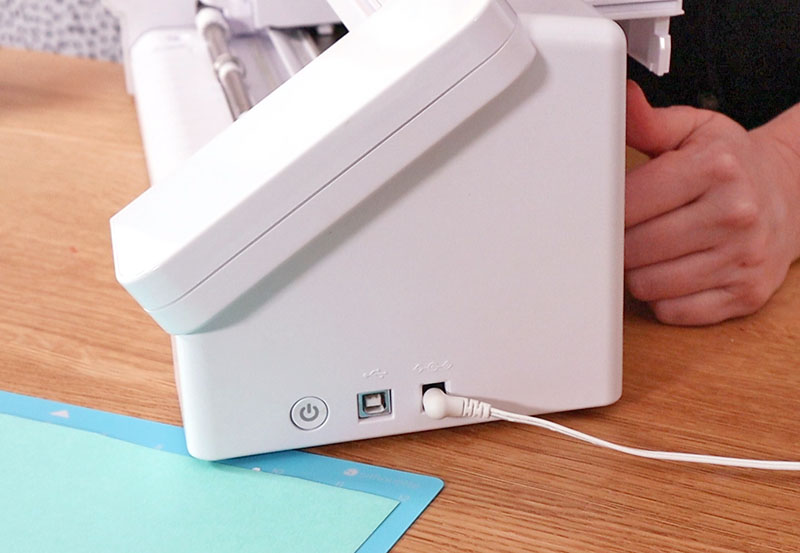 Power cord plugged into side of Silhouette Cameo 4.