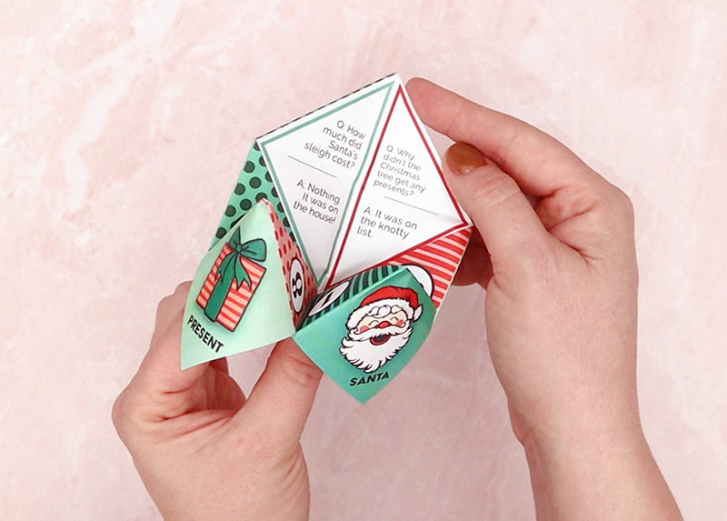 christmas cootie catcher open to show some of the jokes