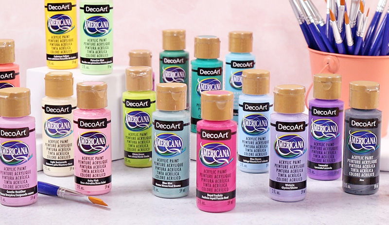 Eighteen bottles of craft paint displayed.