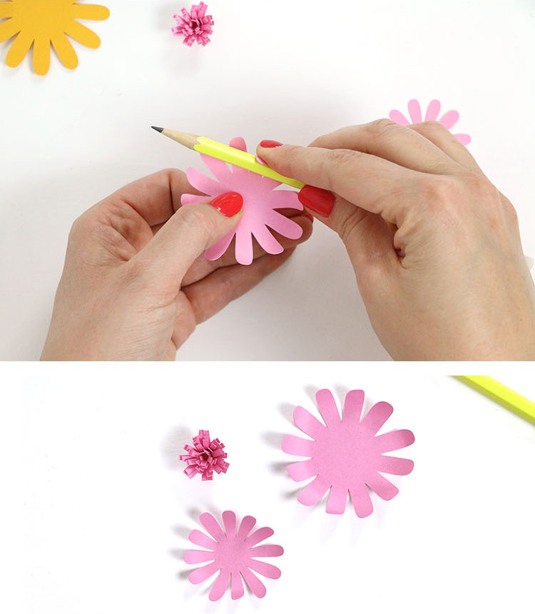 rolling paper flower petals with pencil