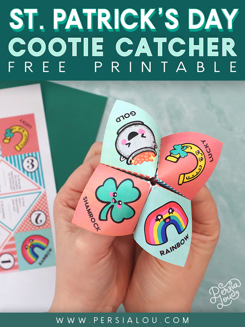Two hands holding a folded paper joke teller / cootie catcher with St. Patrick's Day themed illustrations on the top.