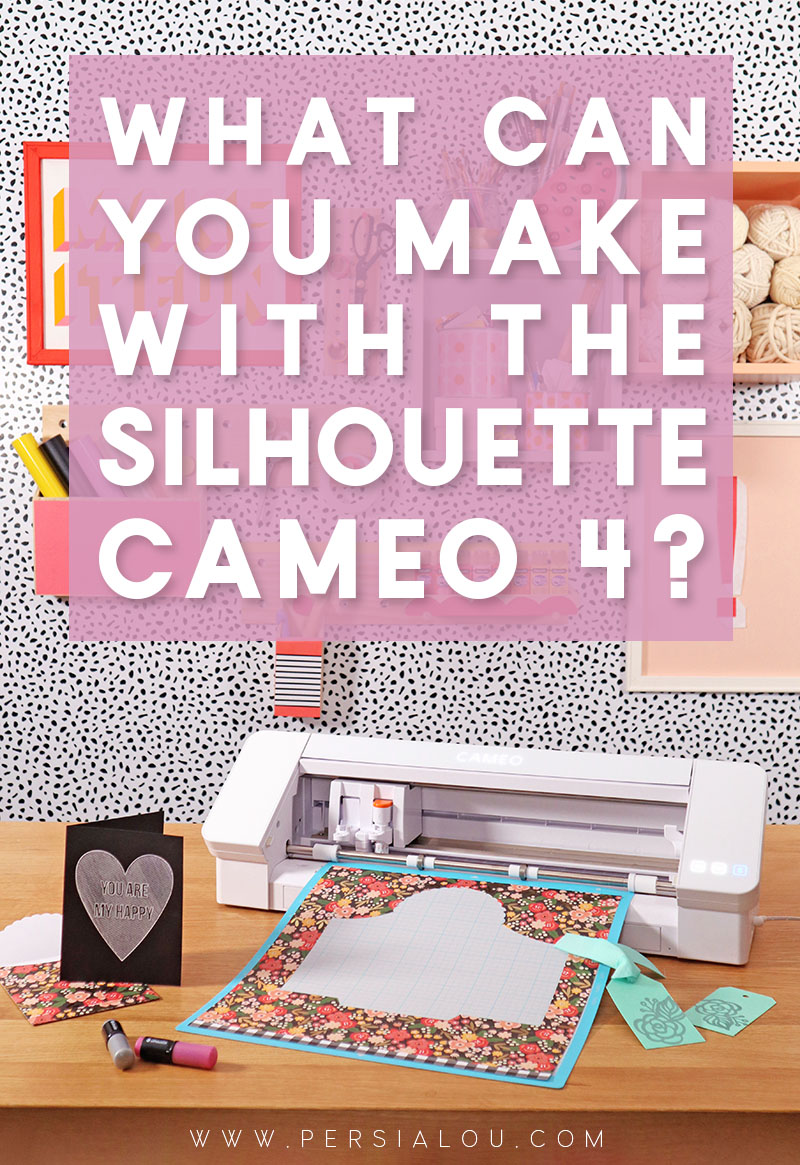Silhouette Cameo 4 sits on wooden surface surrounded by paper crafts