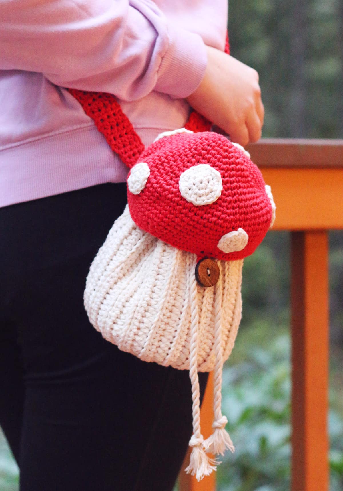 crossbody crochet mushroom bag being worn