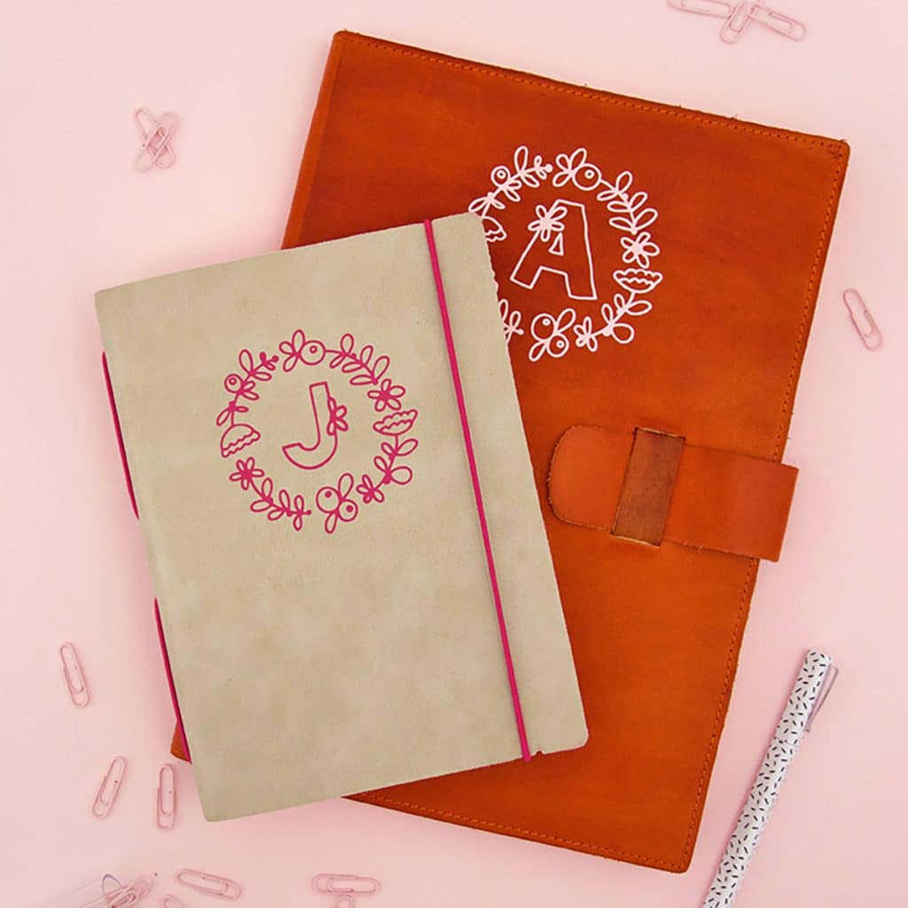 diy notebooks with one letter monograms made with free floral alphabet svgs