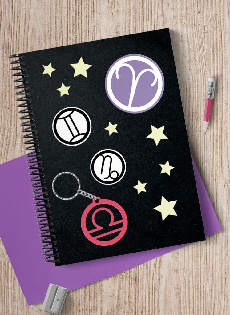 stickers and keychain made with free zodiac symbol svg cut files