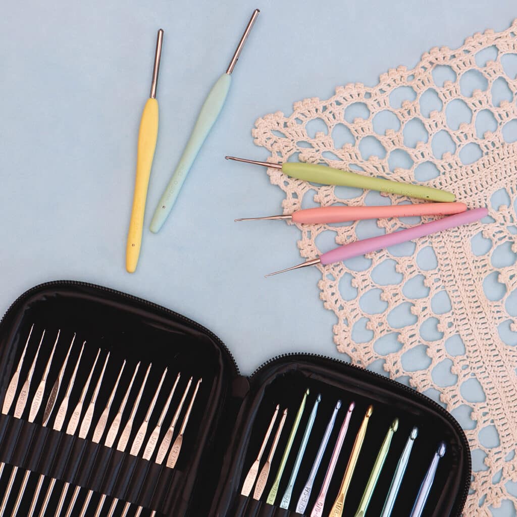two different brands of steel crochet hooks pictured